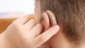 how to adjust hearing aid volume